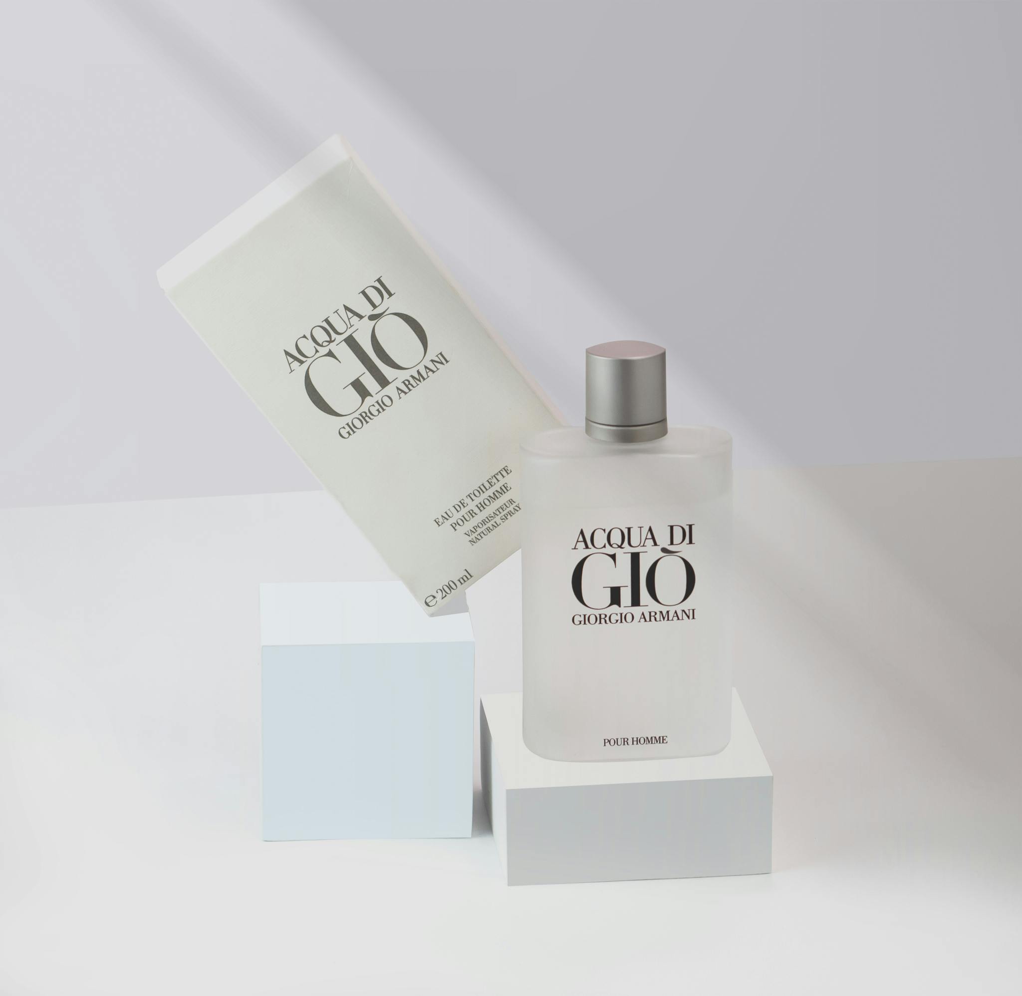 Stylish presentation of Acqua di Gio perfume by Giorgio Armani in a minimalist setting.