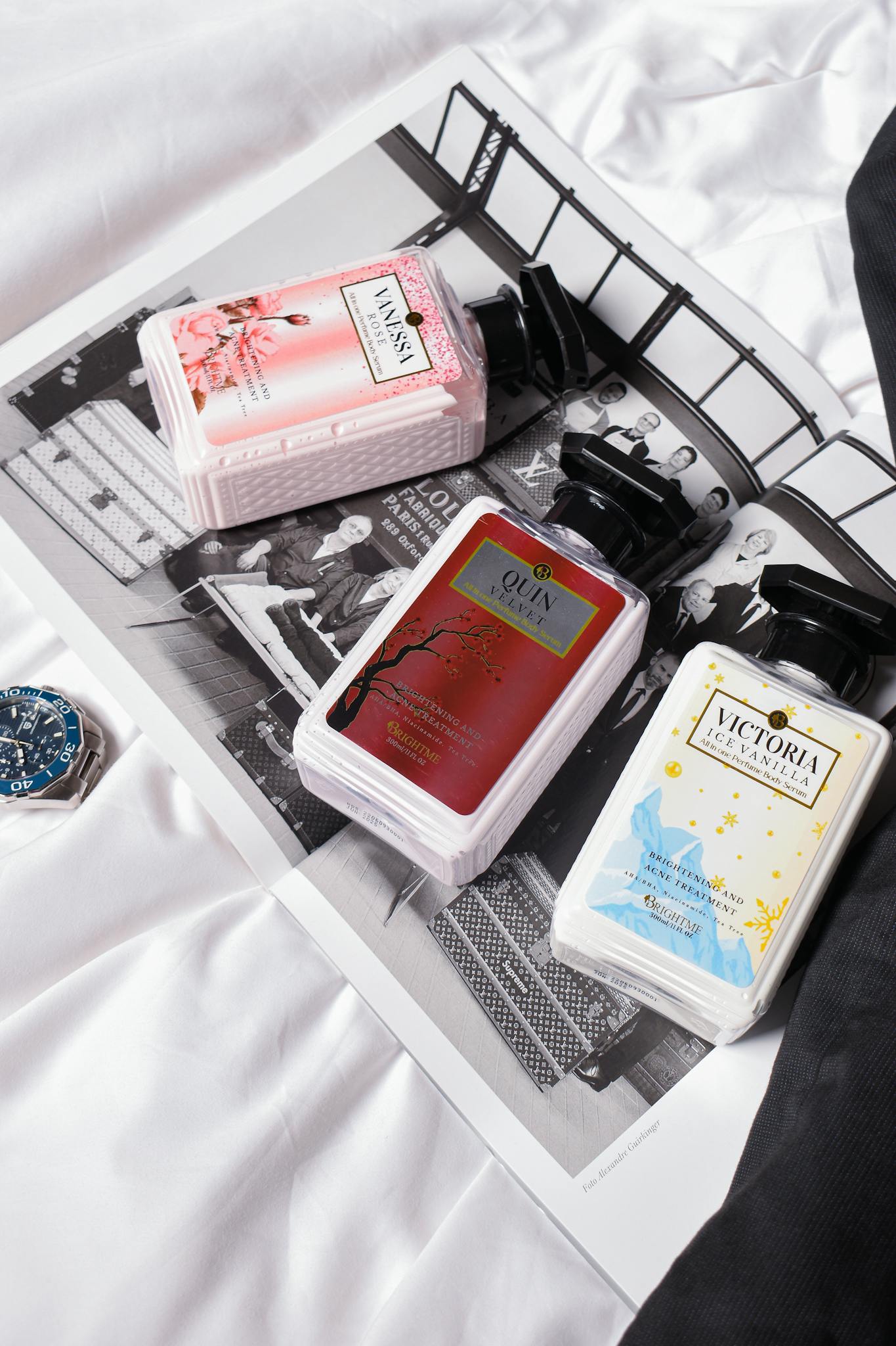 Chic perfume bottles arranged on a vintage magazine, perfect for luxury product photography.